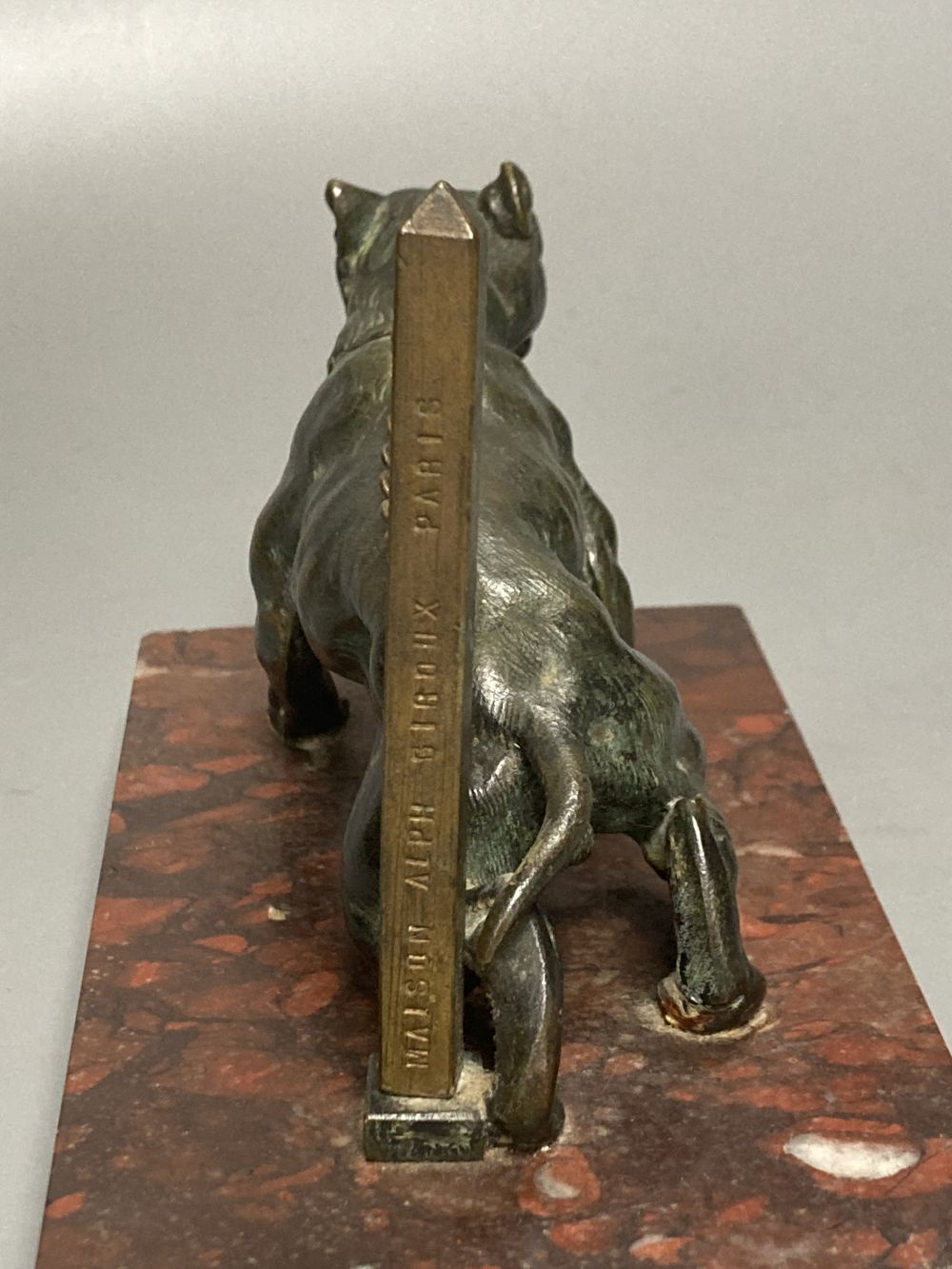 Attributed to Maison Alphonse Giroux - a cast bronze model of a chain tethered Mastiff, on rouge marble plinth, post impressed Maison A